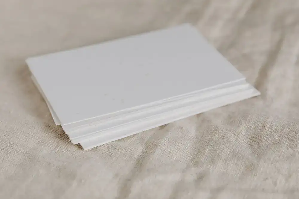Stack of textured solid color papers