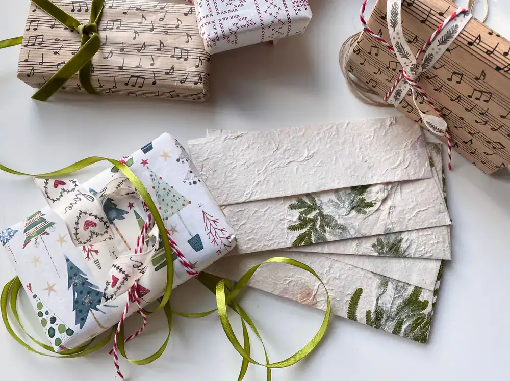Overhead view of textured decorative papers and ribbons
